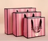 Bolsas de papel cosméticas rayadas rosadas de Pantone CMYK para los regalos de la vuelta